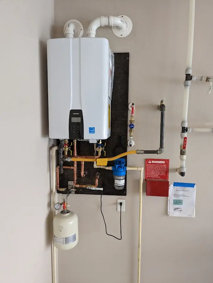 Professional plumber installing copper piping in a South El Monte home